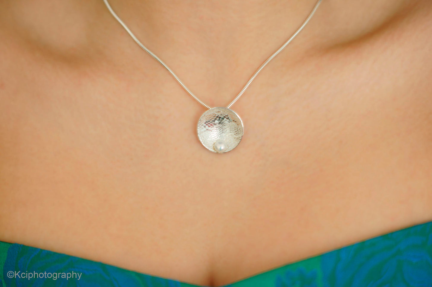 Kate Phipps Jewellery Domed circles necklace lace textured silver with white pearl model photo