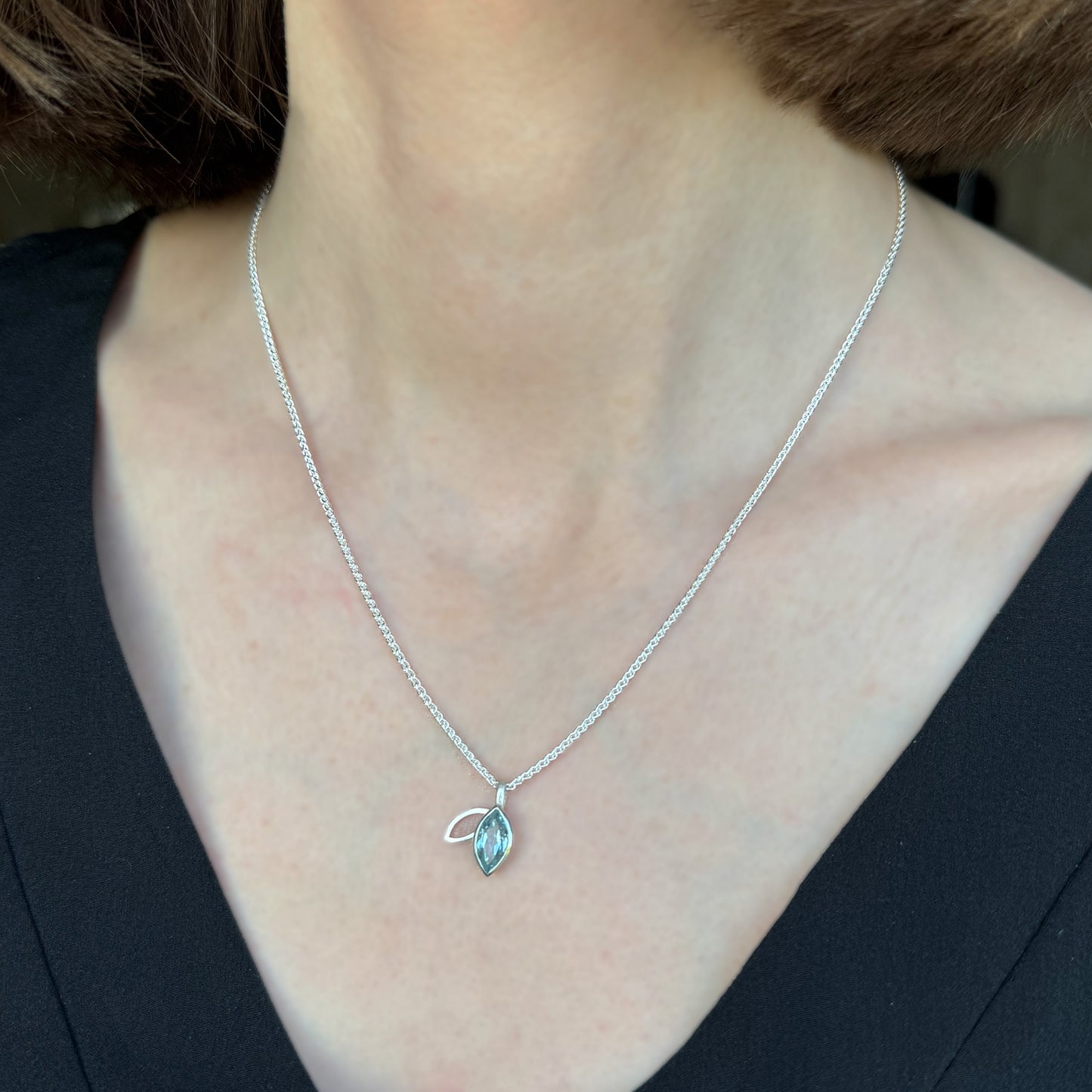 Facet line pendant with sky blue topaz