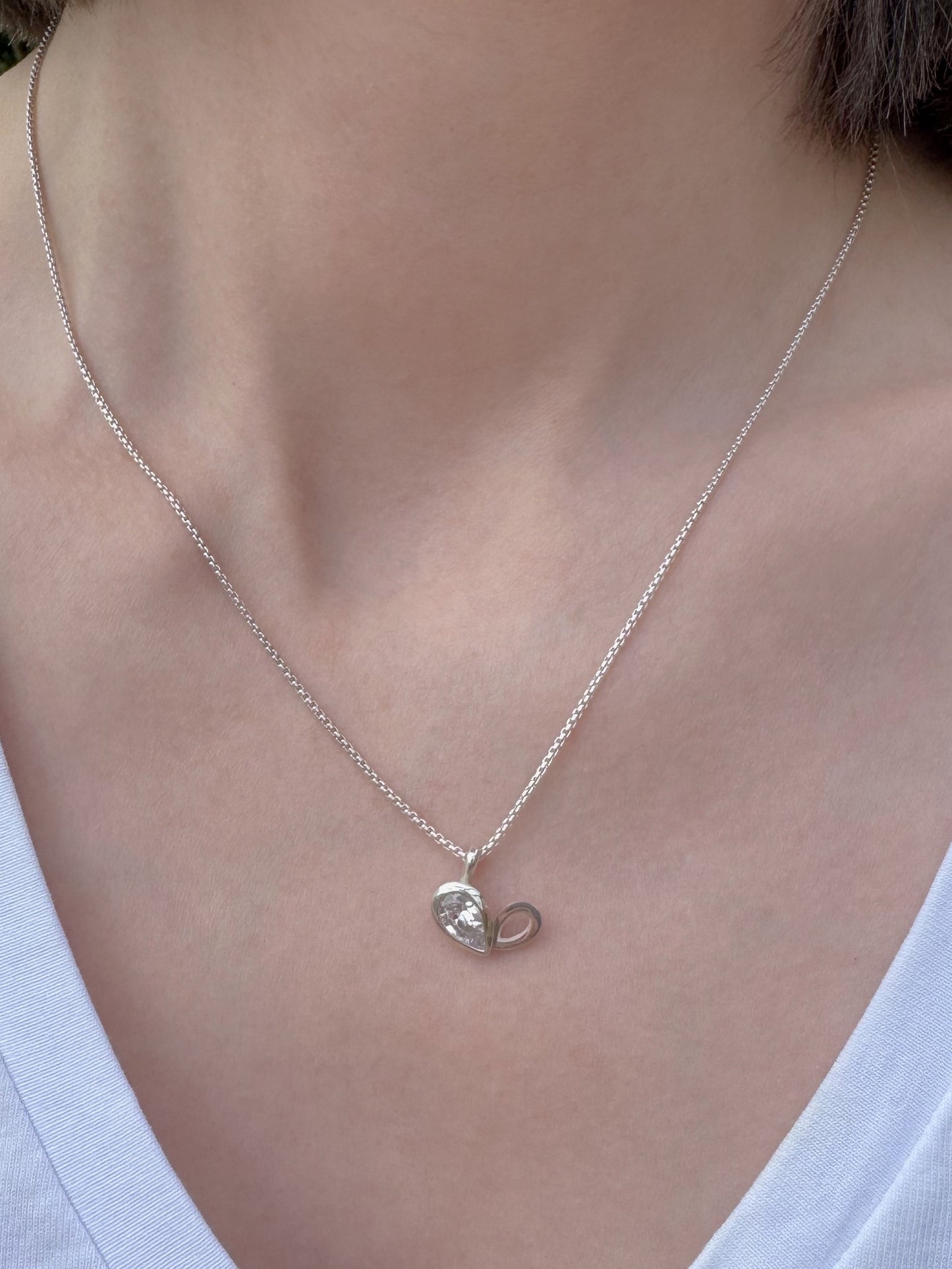 Facet line pendant with pear shaped cubic zirconia