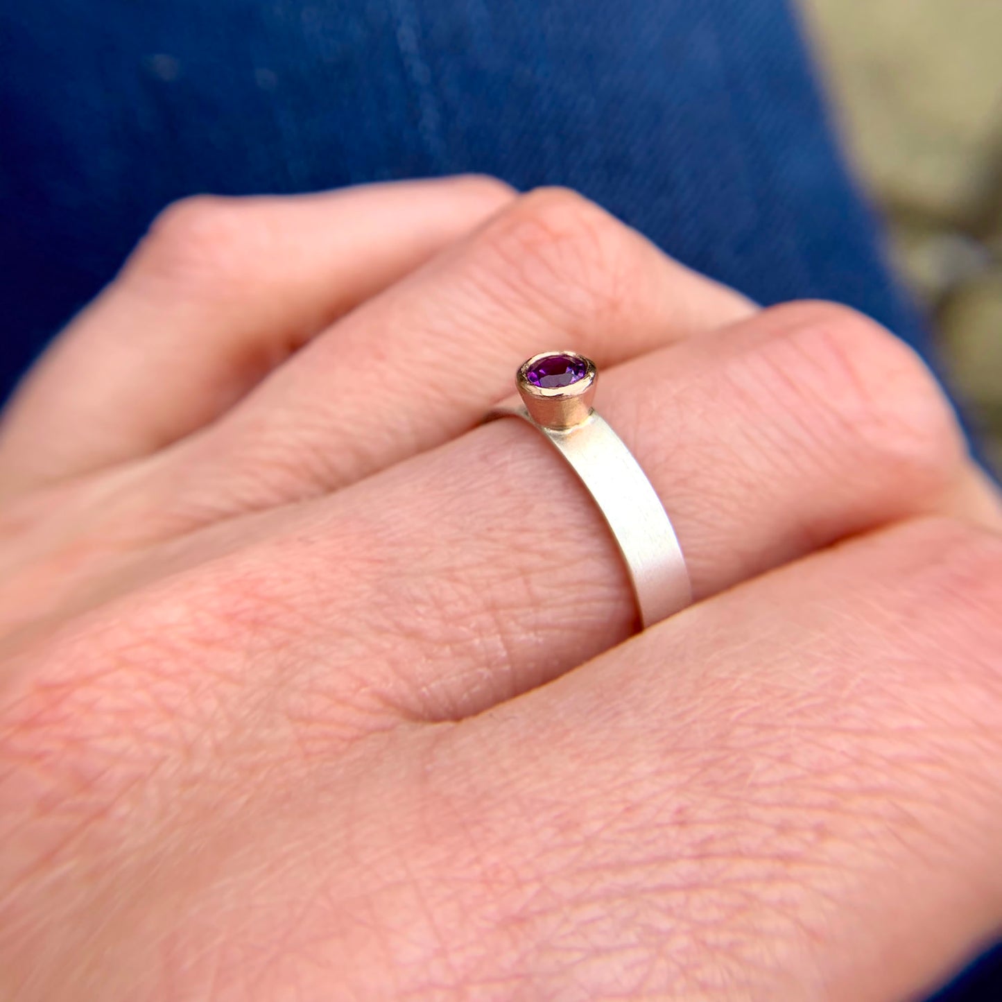 Kate Phipps Jewellery Solitaire ring round amethyst set in 9 carat rose gold on a silver ring band model photo 3