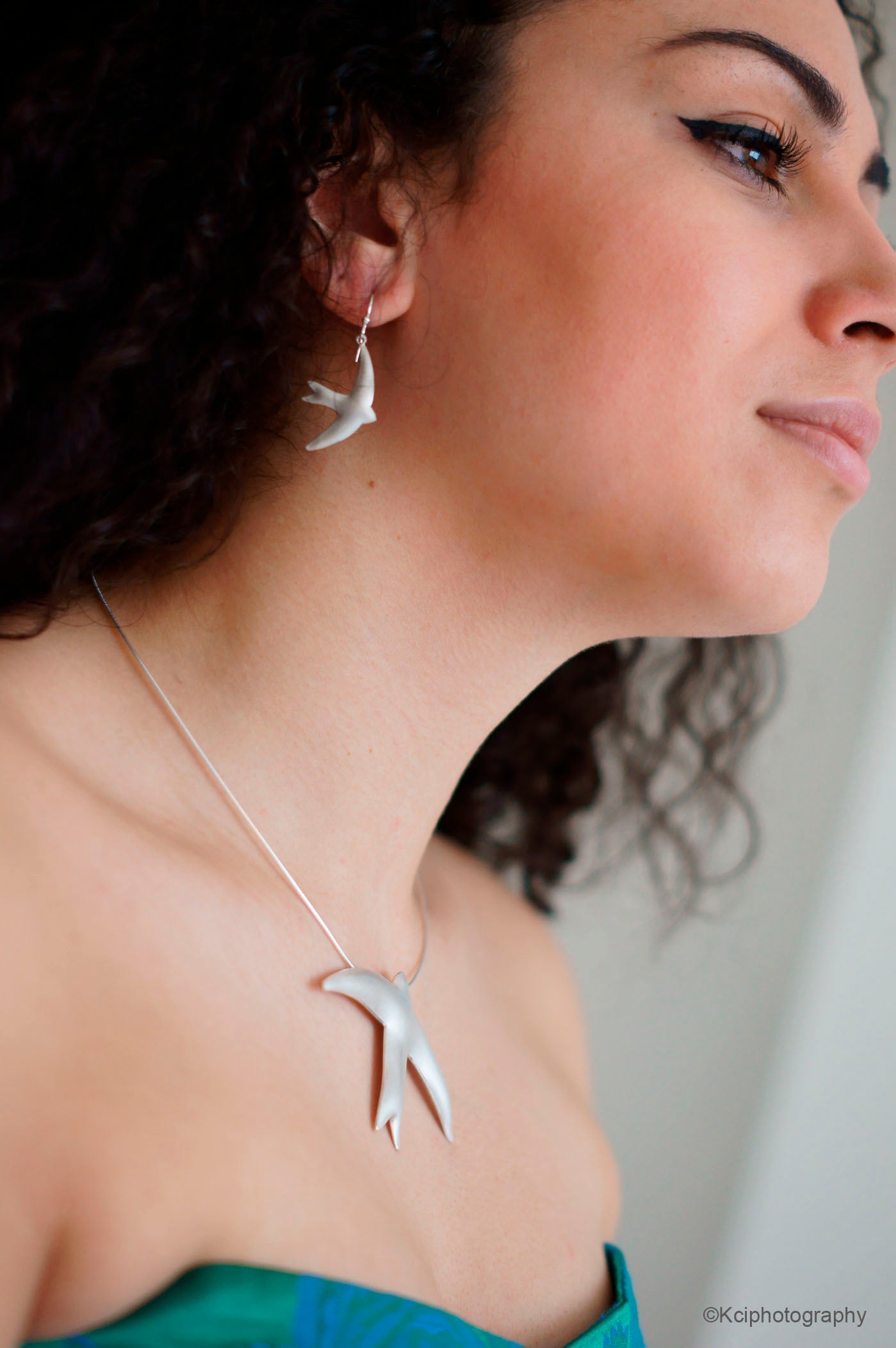Kate Phipps Jewellery silver swift necklace and drop earrings satin finish model photo