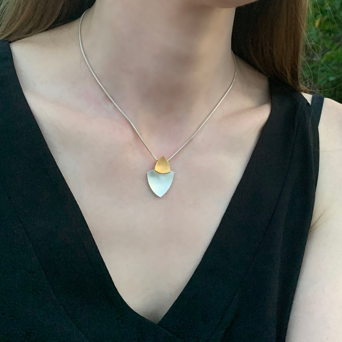 Kate Phipps Jewellery Trillion duo necklace 22 carat yellow gold plated silver top section and silver lower section concave side model photo 1