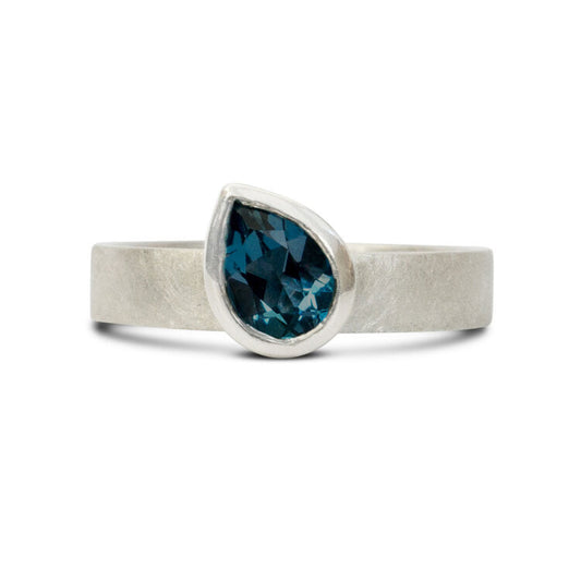 KatePhippsJewellerySolitairering7x5peardarkerLondonbluetopazandsilveroffsetstone
