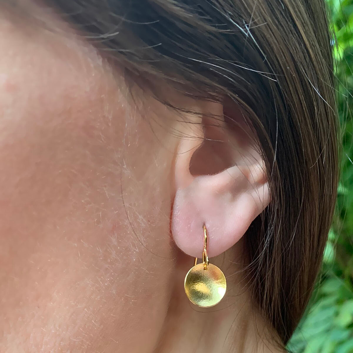 Kate Phipps Jewellery Domed circles drop earrings 22 carat yellow gold plated silver matte finish model photo