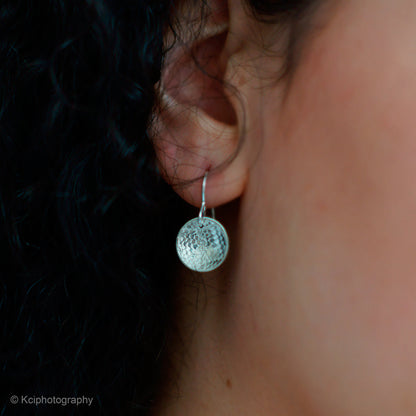 Kate Phipps Jewellery Domed circles drop earrings large lace textured silver model photo