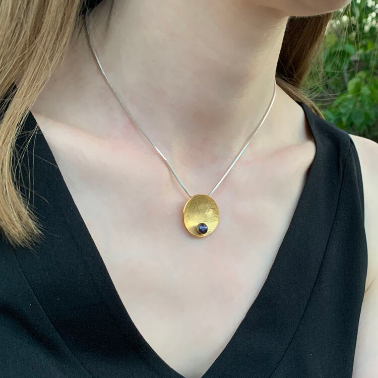 Kate Phipps Jewellery Domed circles necklace leaf skeleton textured 22 carat yellow gold plated silver with peacock pearl model photo