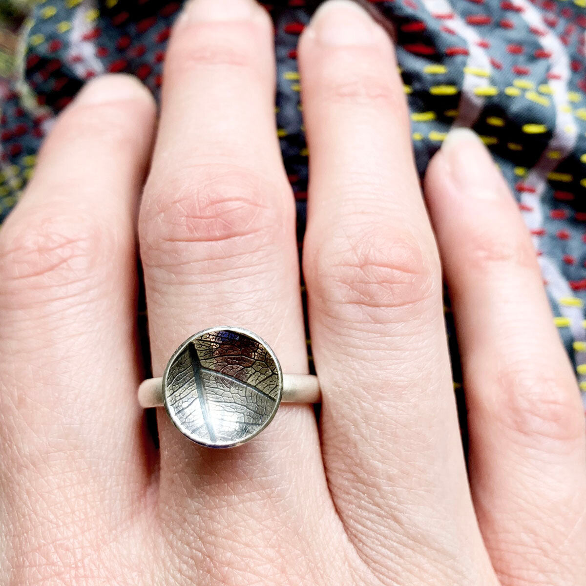 Kate Phipps Jewellery Domed circles ring large oxidised leaf skeleton textured silver model photo