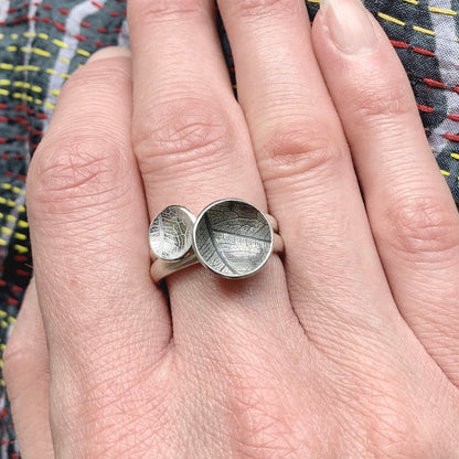 Kate Phipps Jewellery Domed circles ring large oxidised leaf skeleton textured silver stacked with mdium leaf skeleton textured silver ring model photo