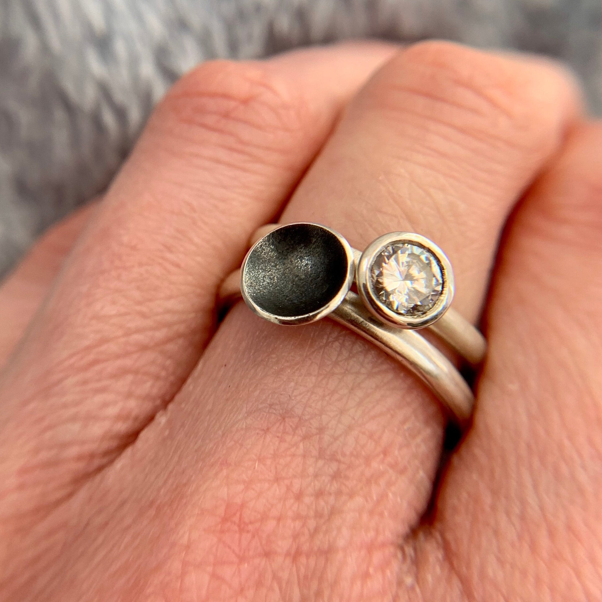 Kate Phipps Jewellery Domed circles ring medium oxidised silver stacked with scattered trillions silver and clear cubic zirconia ring model  photo