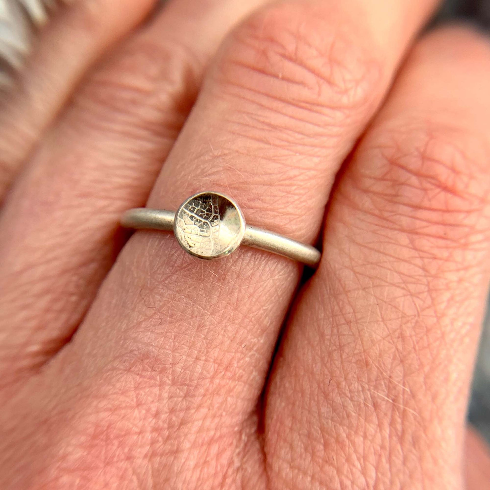 Kate Phipps Jewellery Domed circles ring small leaf skeleton textured silver model photo