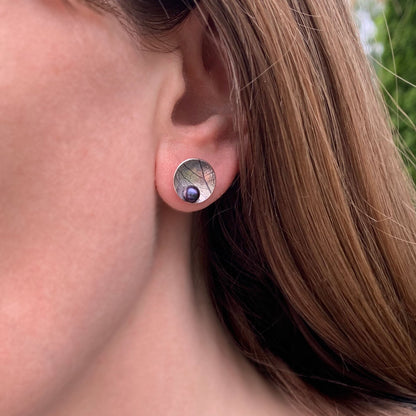 Kate Phipps Jewellery Domed circles stud earrings large oxidised leaf skeleton textured silver with peacock pearl model photo