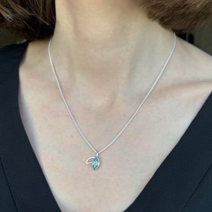 Facet line pendant with sky blue topaz