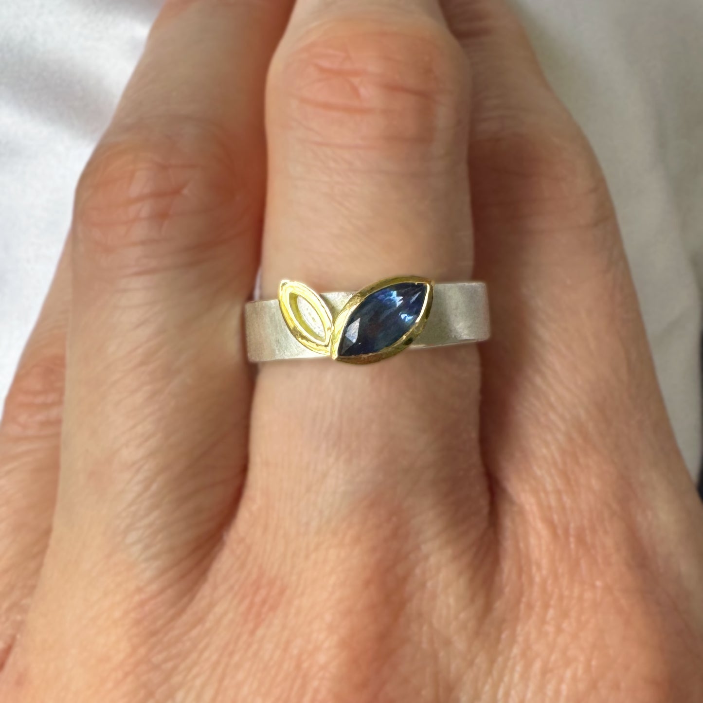 Facet Line ring with marquise shaped blue sapphire, 18 carat yellow gold and silver - size O 1/2 to P