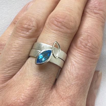 Facet Line ring set with marquise shaped Swiss blue topaz - size O to O 1/2
