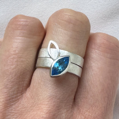 Facet Line ring set with marquise shaped Swiss blue topaz - size O to O 1/2