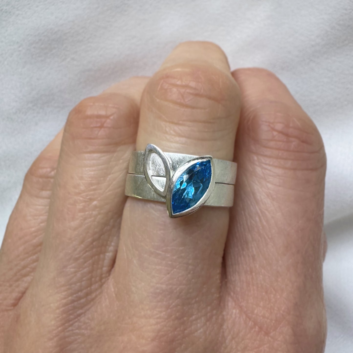 Facet Line ring set with marquise shaped Swiss blue topaz - size O to O 1/2