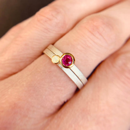 Kate Phipps Jewellery Nugget ring ruby set in 18 carat yellow gold and 18 carat yellow gold nugget stacking ring pair on silver ring bands model photo