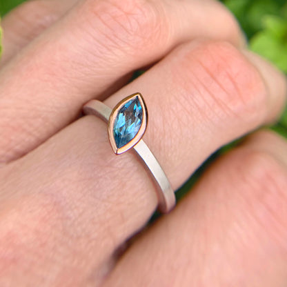 Kate Phipps Jewellery Nugget stacking rings marquise swiss blue topaz set in 9 carat rose gold on silver ring bands model photo