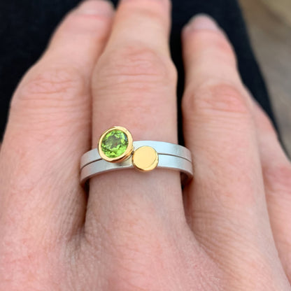 Kate Phipps Jewellery Nugget stacking rings set with peridot set in 18 carat yellow gold and gold nugget on silver ring bands model photo 1