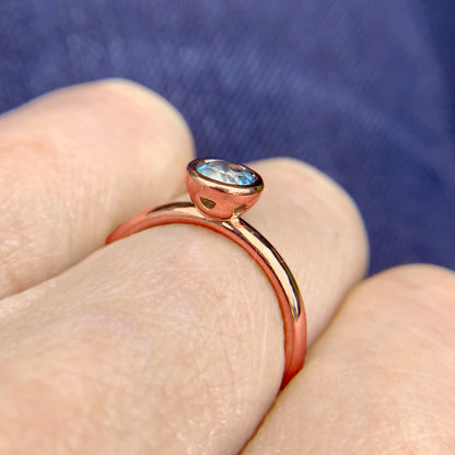 Kate Phipps Jewellery Scattered trillions ring 9 carat solid rose gold with dark aquamarine model photo 3
