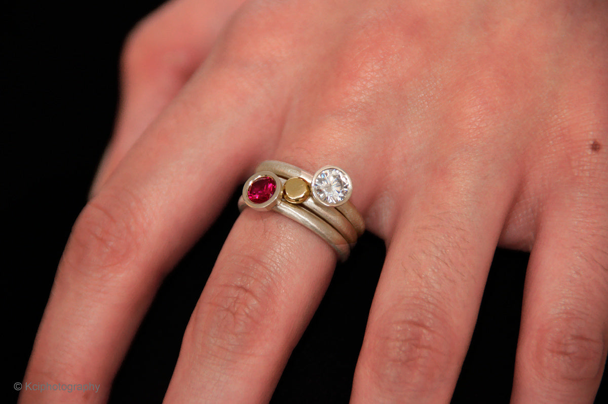 Kate Phipps Jewellery Scattered trillions ring and nugget ring silver with synthetic ruby and clear cubic zirconia and 18 carat yellow gold nugget and silver ring model  photo  