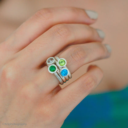 Kate Phipps Jewellery Scattered trillions ring blue and green stones set in silver square photo model  photo  