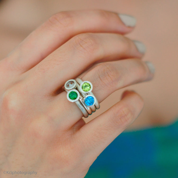 Kate Phipps Jewellery Scattered trillions ring blue and green stones set in silver square photo model  photo  