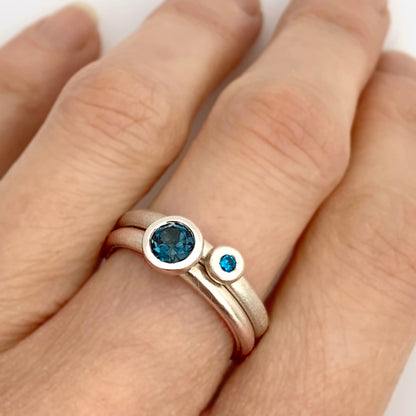 Kate Phipps Jewellery Scattered trillions ring with London blue topaz in silver and silver nugget ring with turquoise cubic zirconia model  photo