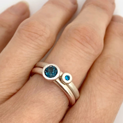 Kate Phipps Jewellery Scattered trillions ring with London blue topaz in silver and silver nugget ring with turquoise cubic zirconia model  photo