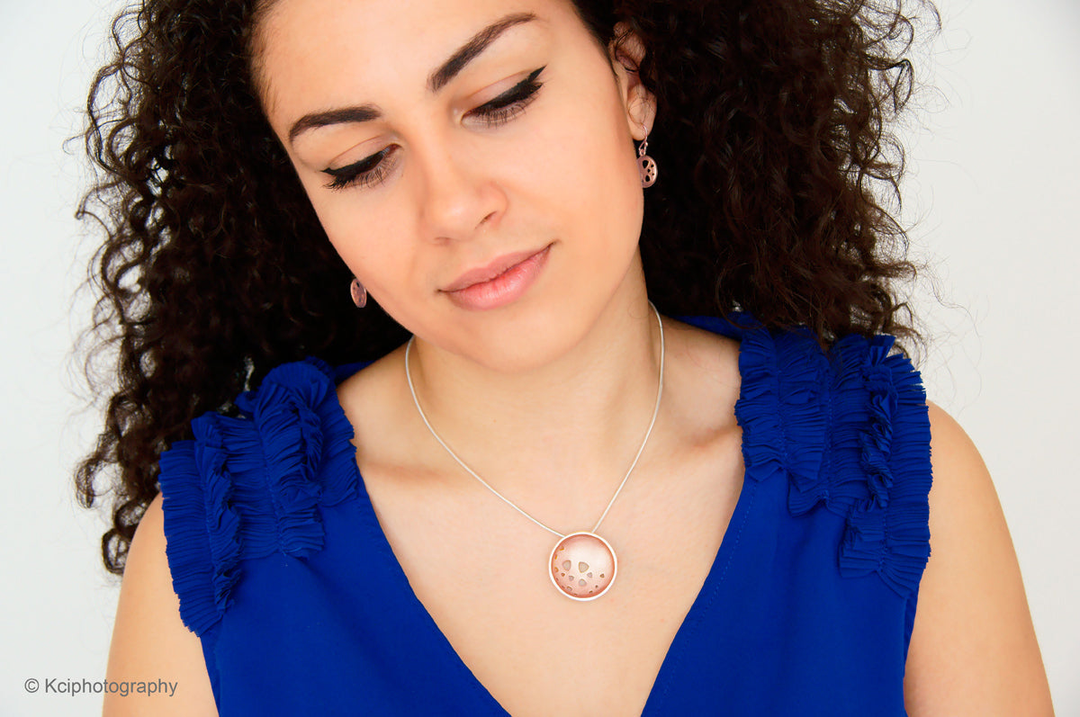 Kate Phipps Jewellery Scattered trillions set 18 carat rose gold plated silver large pendant and drop earrings model photo