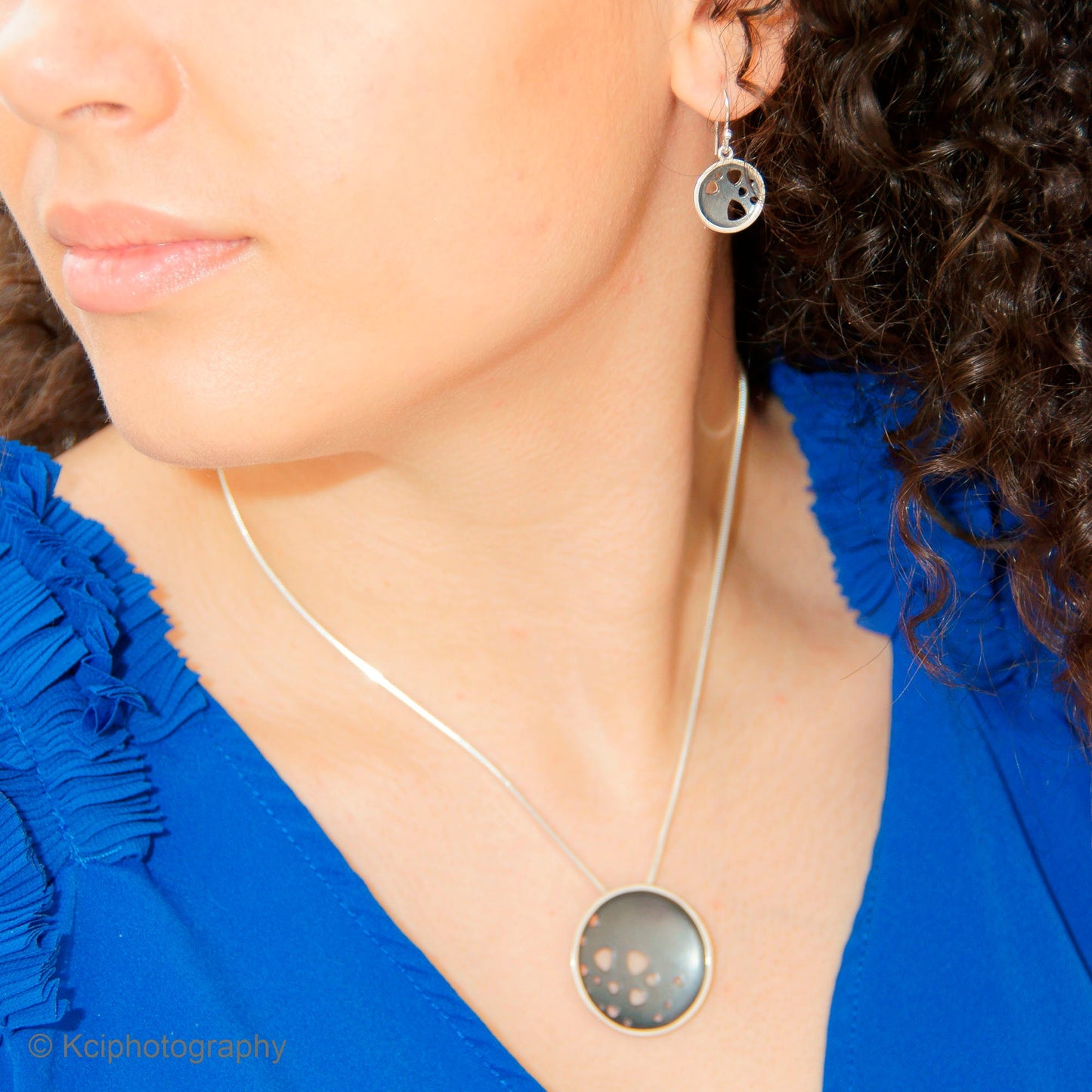 Kate Phipps Jewellery Scattered trillions set large oxidised silver necklace and oxidised silver drop earrings model photo 