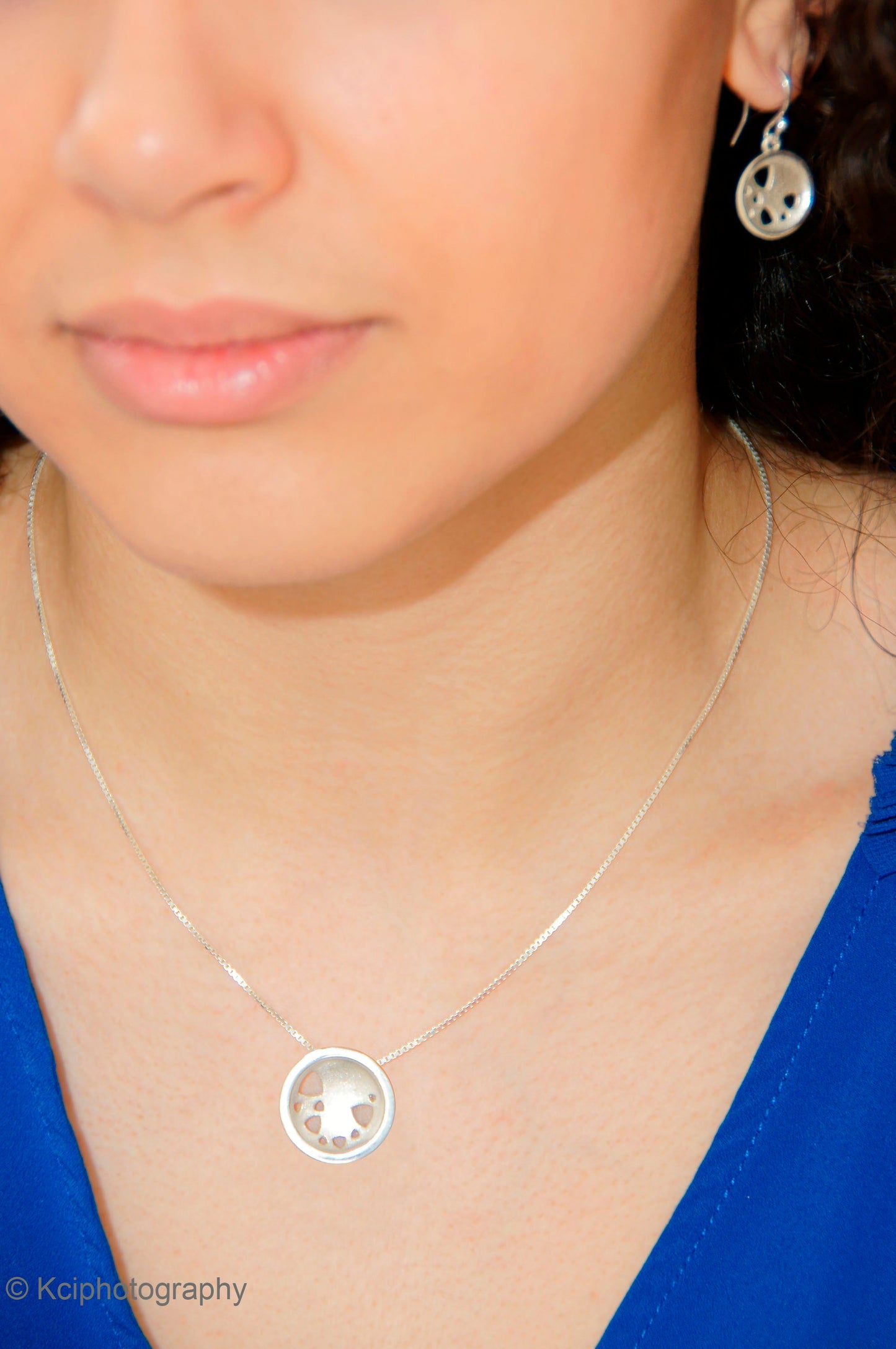 Kate Phipps Jewellery Scattered trillions set medium silver necklace and silver drop earrings model photo 