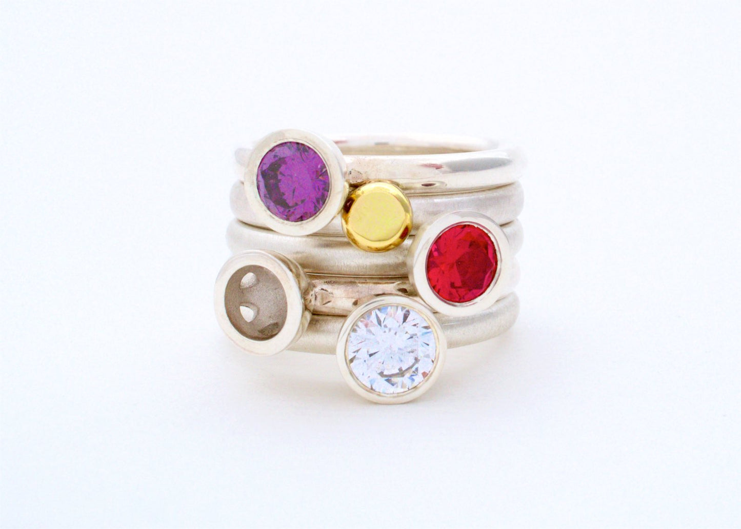 Kate Phipps Jewellery Scattered trillions stacking rings stacked synthetic amethyst clear cubic zirconia silver and 18 carat yellow gold nugget