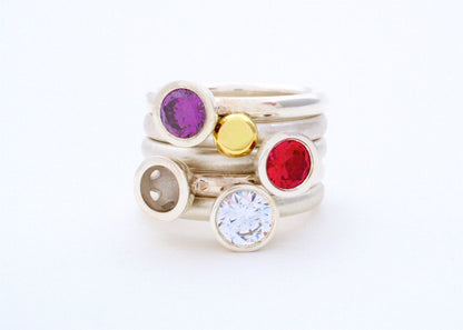 Kate Phipps Jewellery Scattered trillions stacking rings stacked synthetic amethyst clear cubic zirconia silver and 18 carat yellow gold nugget