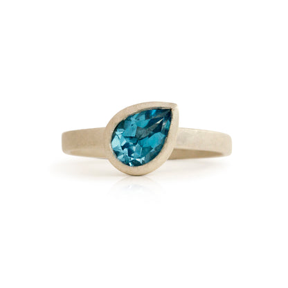 Kate Phipps Jewellery Solitaire ring pear shaped silver and Swiss blue topaz angled stone