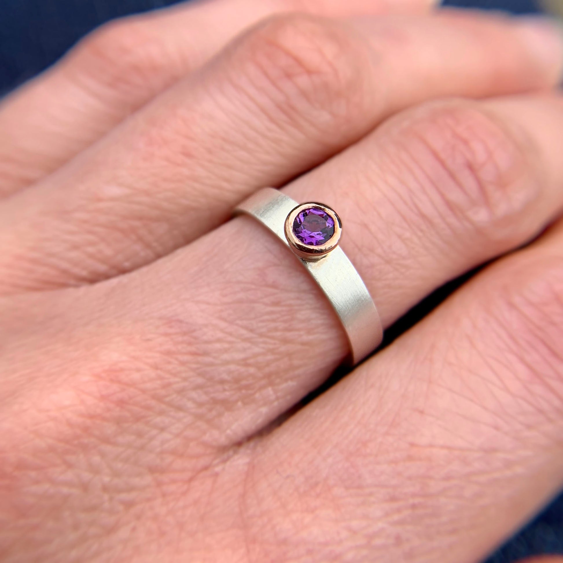 Kate Phipps Jewellery Solitaire ring round amethyst set in 9 carat rose gold on a silver ring band model photo 2