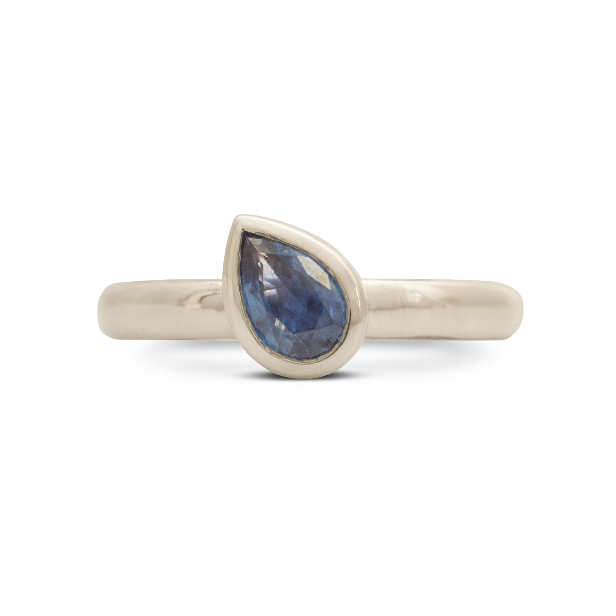 Kate Phipps Jewellery Solitaire ring silver and 6x4 mm pear blue sapphire angled