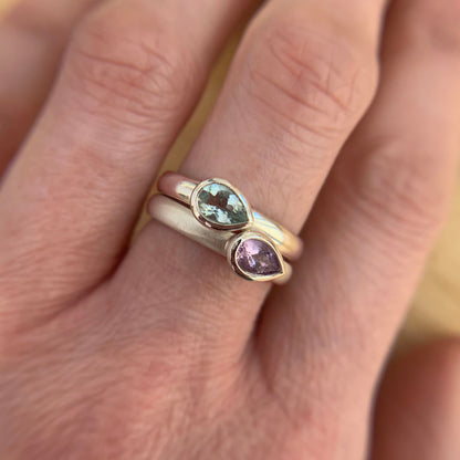 Kate Phipps Jewellery Stacking ring pair silver with pear shaped green beryl and pale amethyst pointing same direction model photo