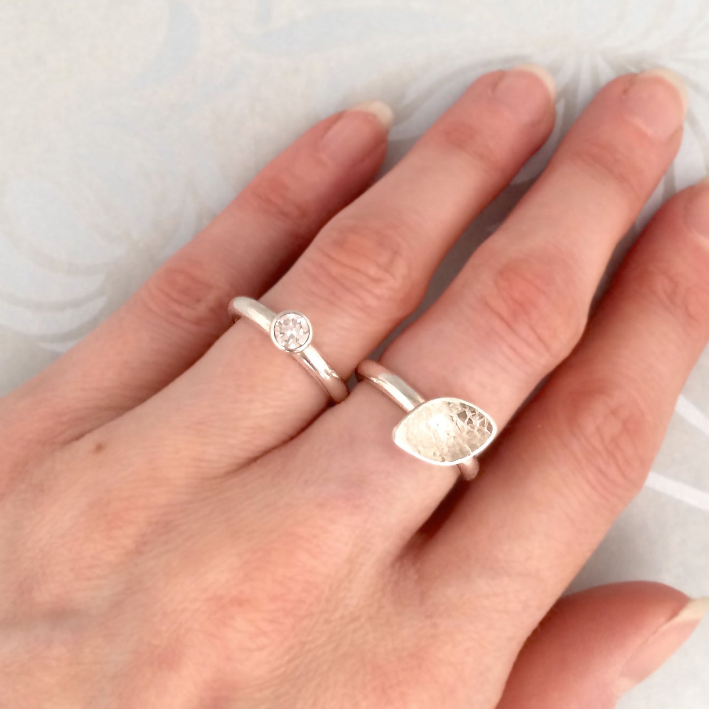 Kate Phipps Jewellery Stacking rings clear cubic zirconia and silver ring and lace textured leaf shaped silver ring model photo 1