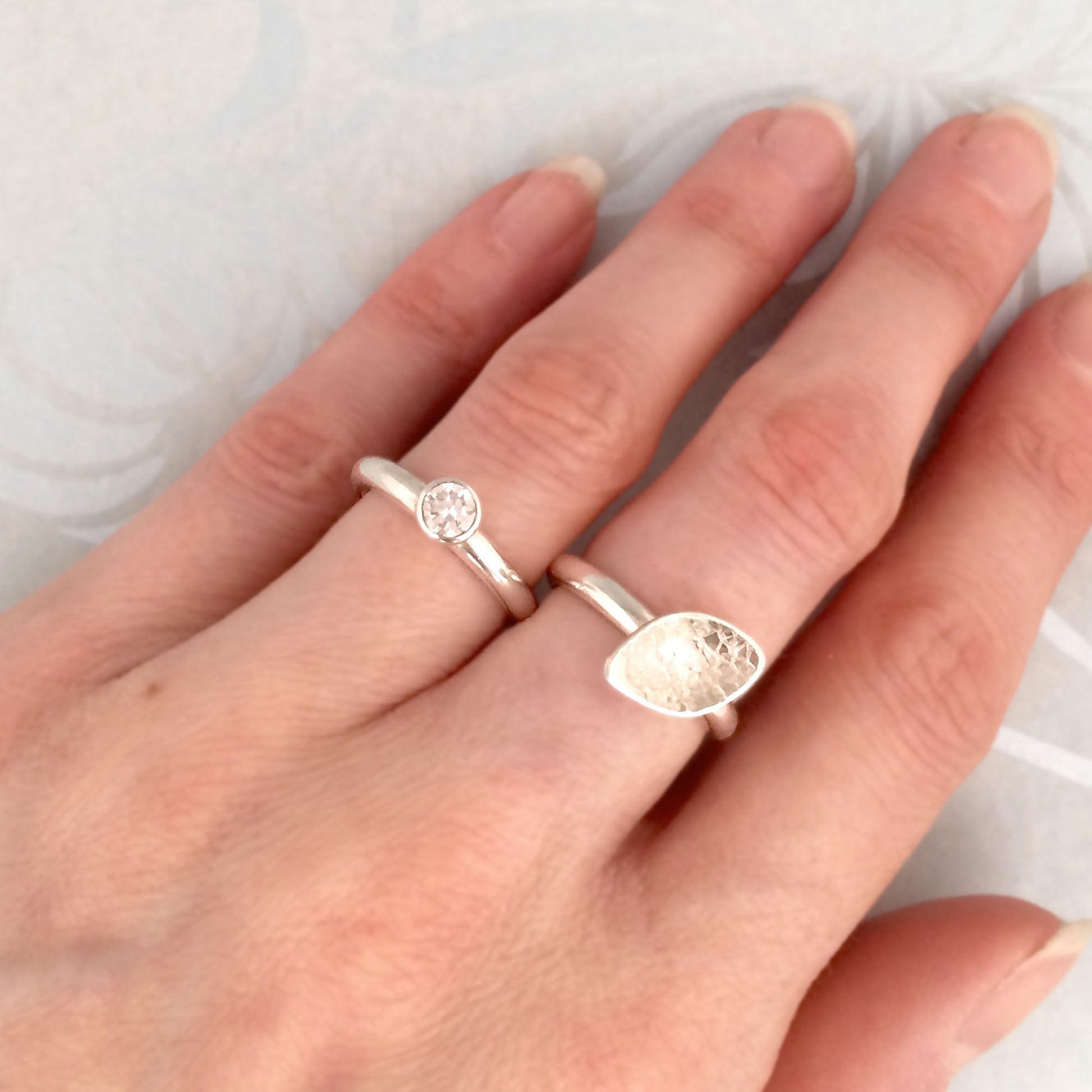 Kate Phipps Jewellery Stacking rings clear cubic zirconia and silver ring and lace textured leaf shaped silver ring model photo 1