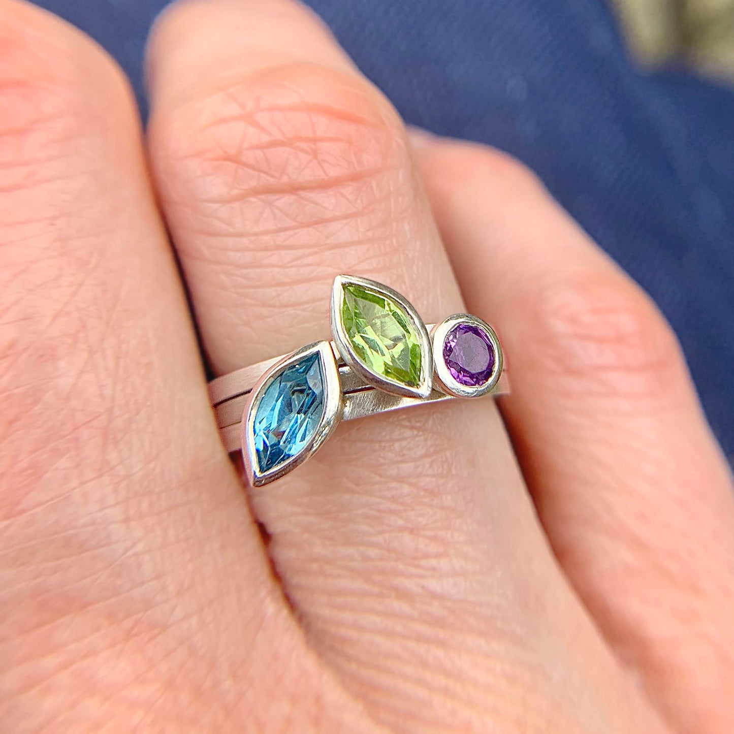 Kate Phipps Jewellery Stacking rings trio of rings with marquise peridot marquise Swiss blue topaz and round amethyst in silver model photo 1