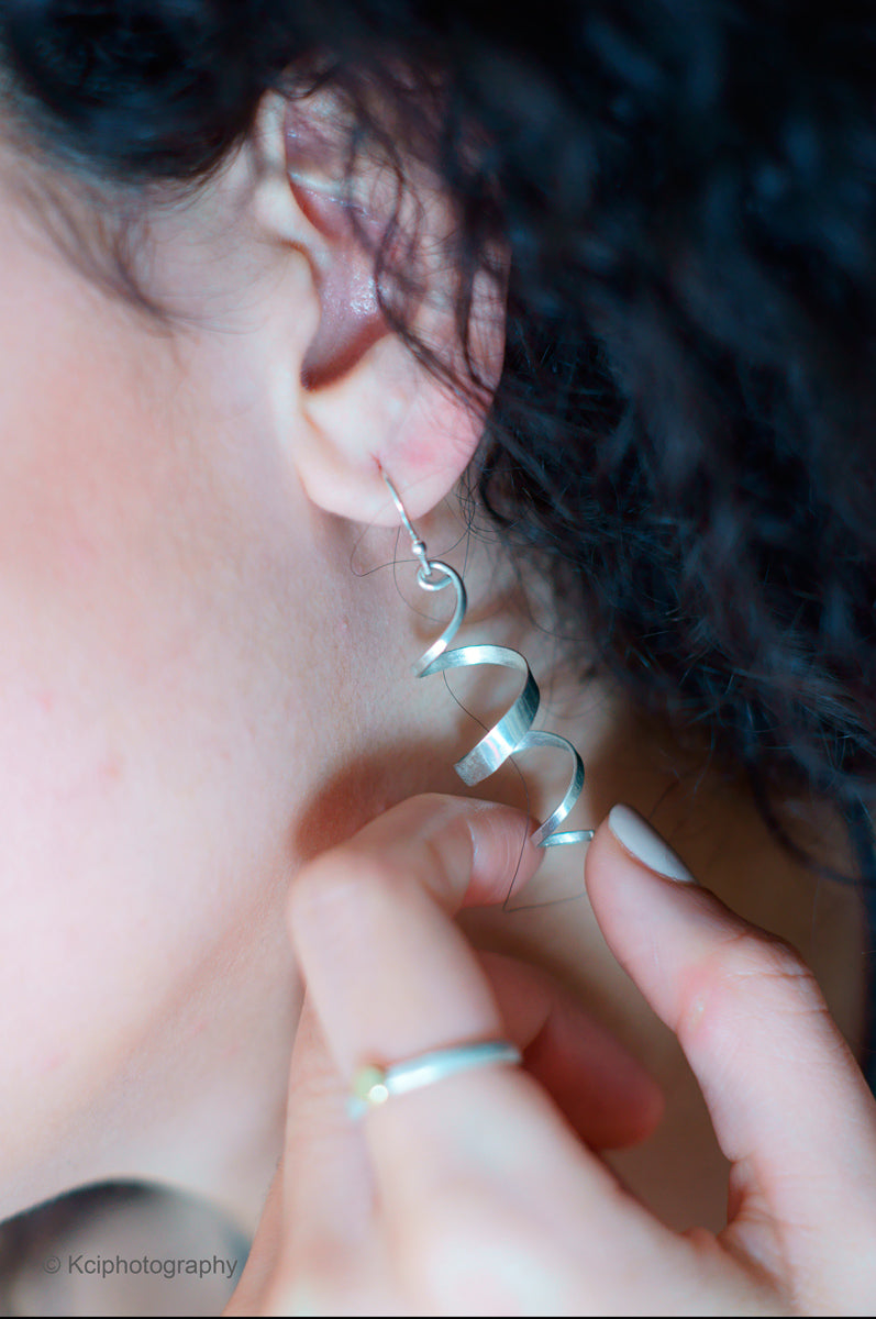 Kate Phipps Jewellery yellow gold plated silver swirl drop earrings product photo front on