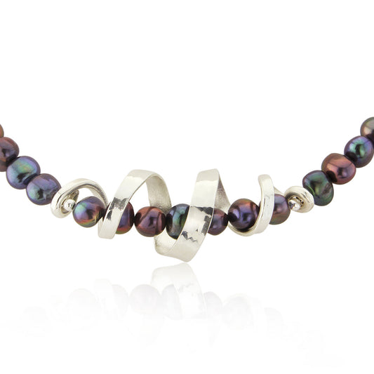 Kate Phipps Jewellery silver swirl and peacock pearl necklace close up product photo