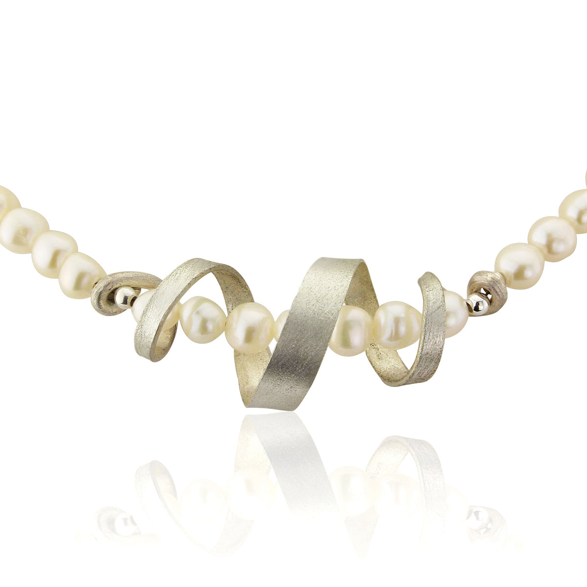 Kate Phipps Jewellery silver swirl and white pearl necklace close up product photo