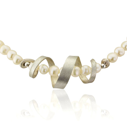 Kate Phipps Jewellery silver swirl and white pearl necklace close up product photo