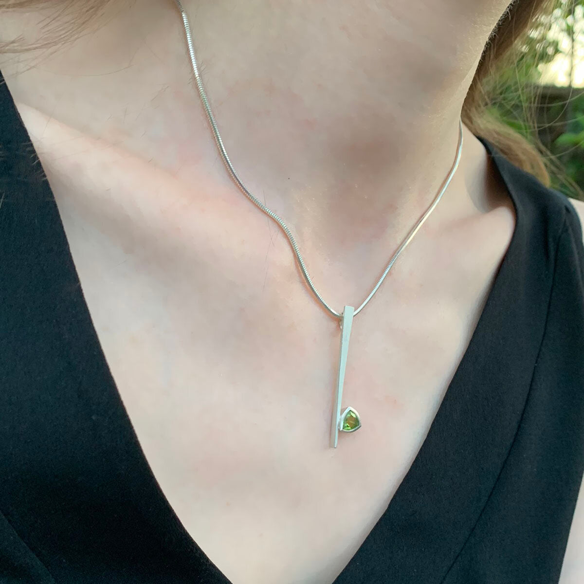Kate Phipps Jewellery silver and trillion cut peridot necklace model photo