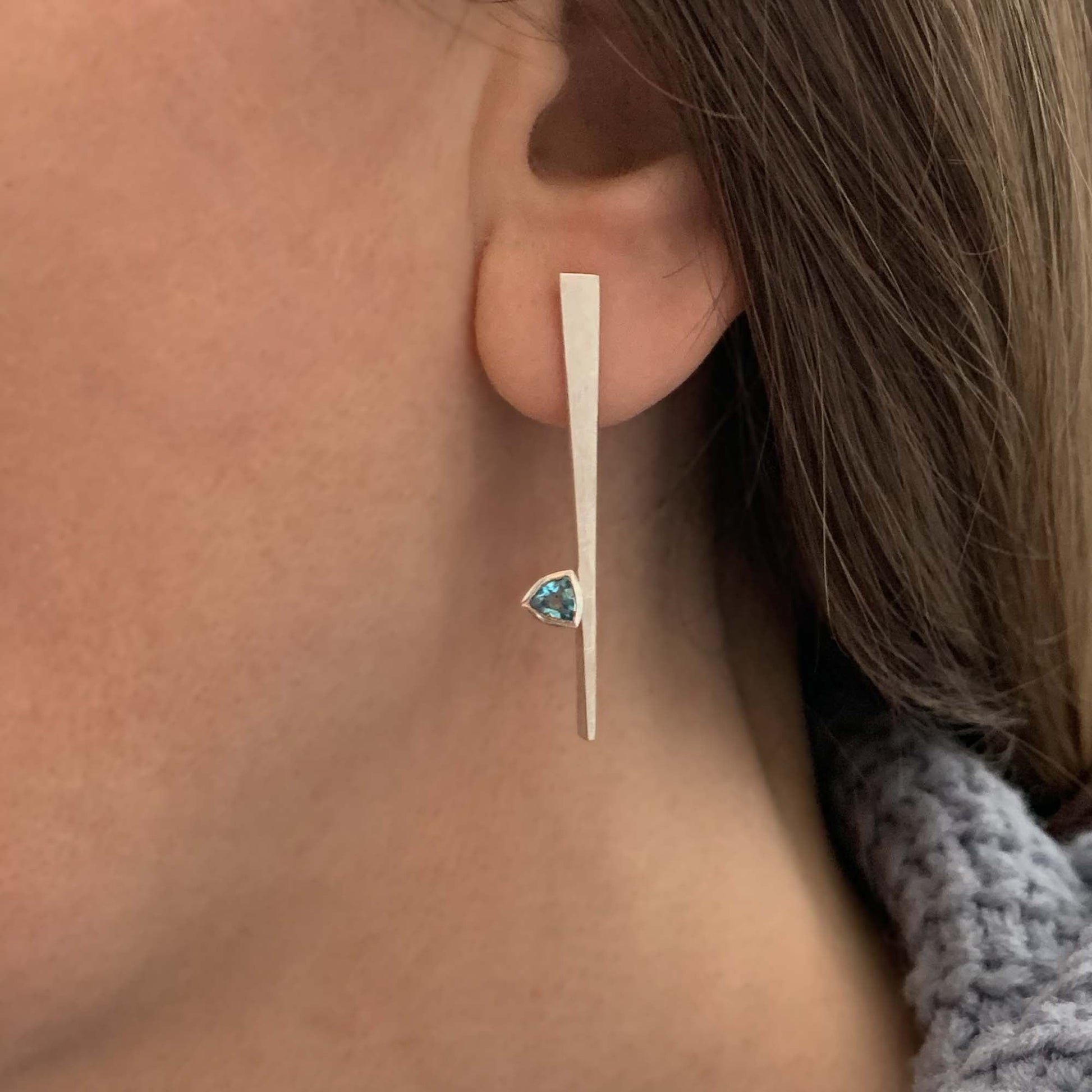 Kate Phipps Jewellery silver and Swiss blue topaz tapered stud earrings model photo