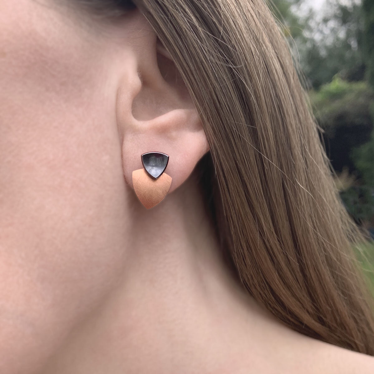Kate Phipps Jewellery Trillion duo multiway stud earrings oxidised silver stud and 18 carat rose gold plated silver lower section model photo 2