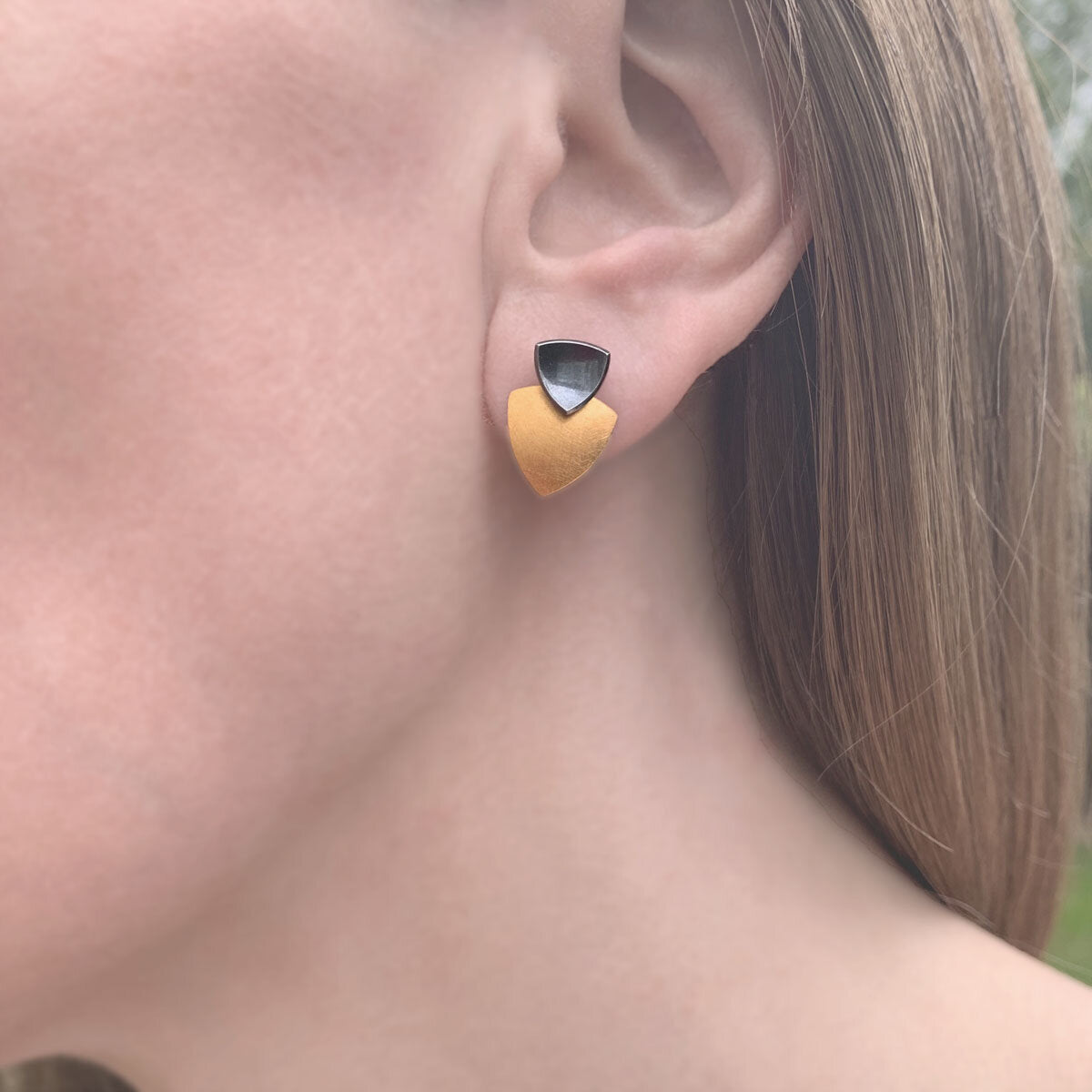 Kate Phipps Jewellery Trillion duo multiway stud earrings oxidised silver stud and 22 carat yellow gold plated silver lower section model photo