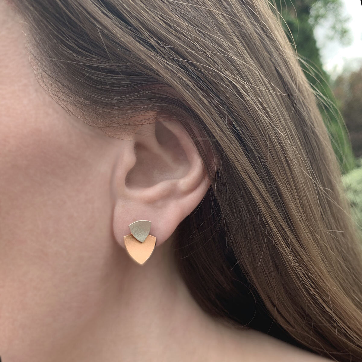 Kate Phipps Jewellery Trillion duo multiway stud earrings silver stud and 18 carat rose gold plated silver lower section concave side model photo 1